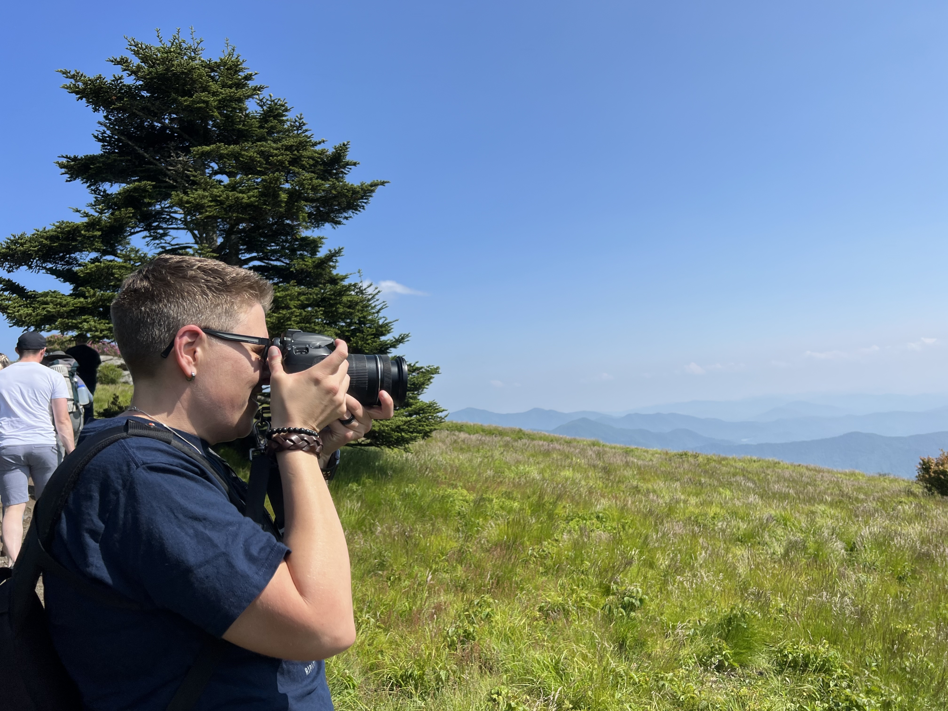 Kate taking pictures in the mountains.