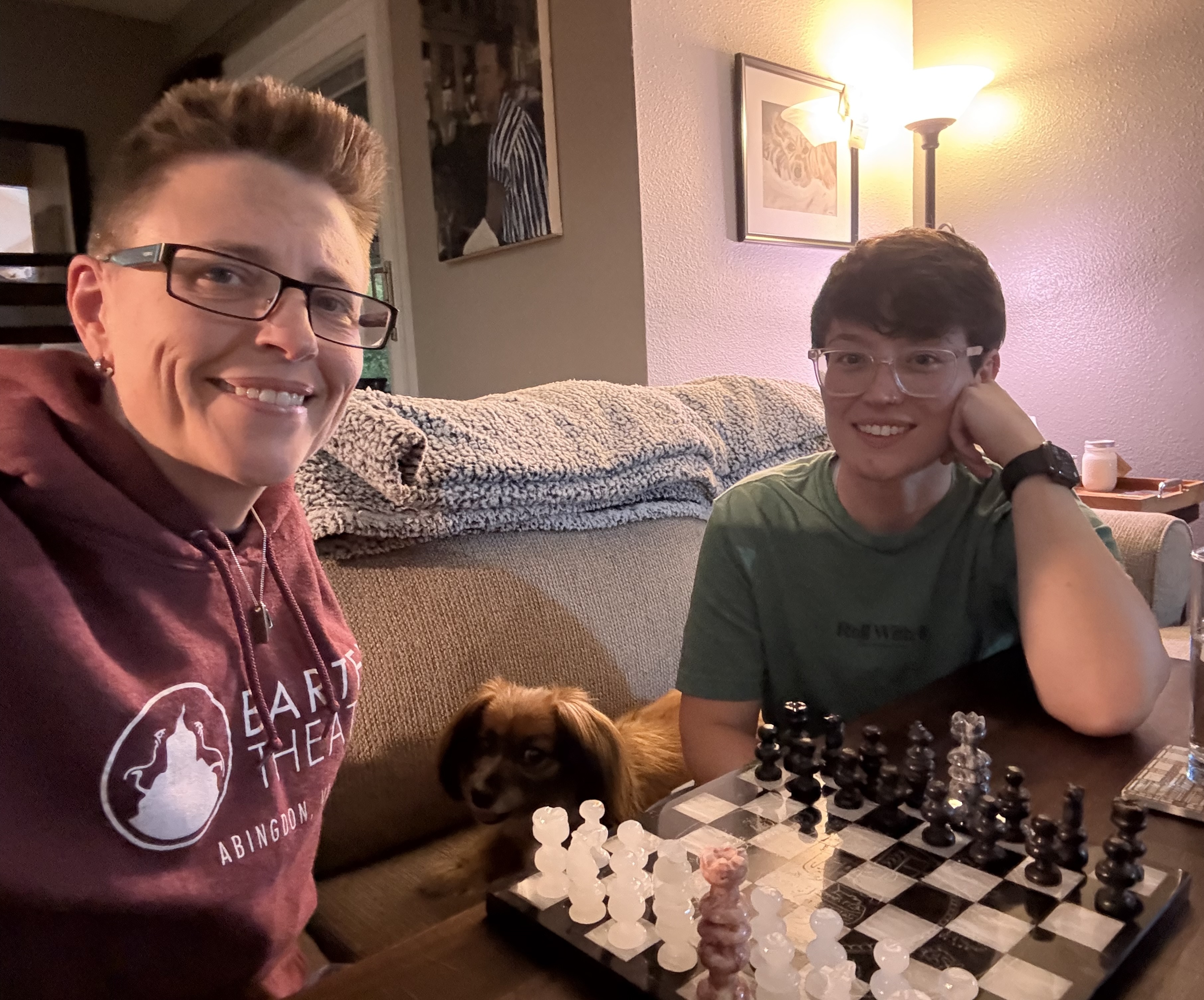 Kate playing chess with her wife.