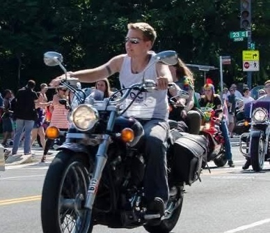 Kate with her motorcycle.