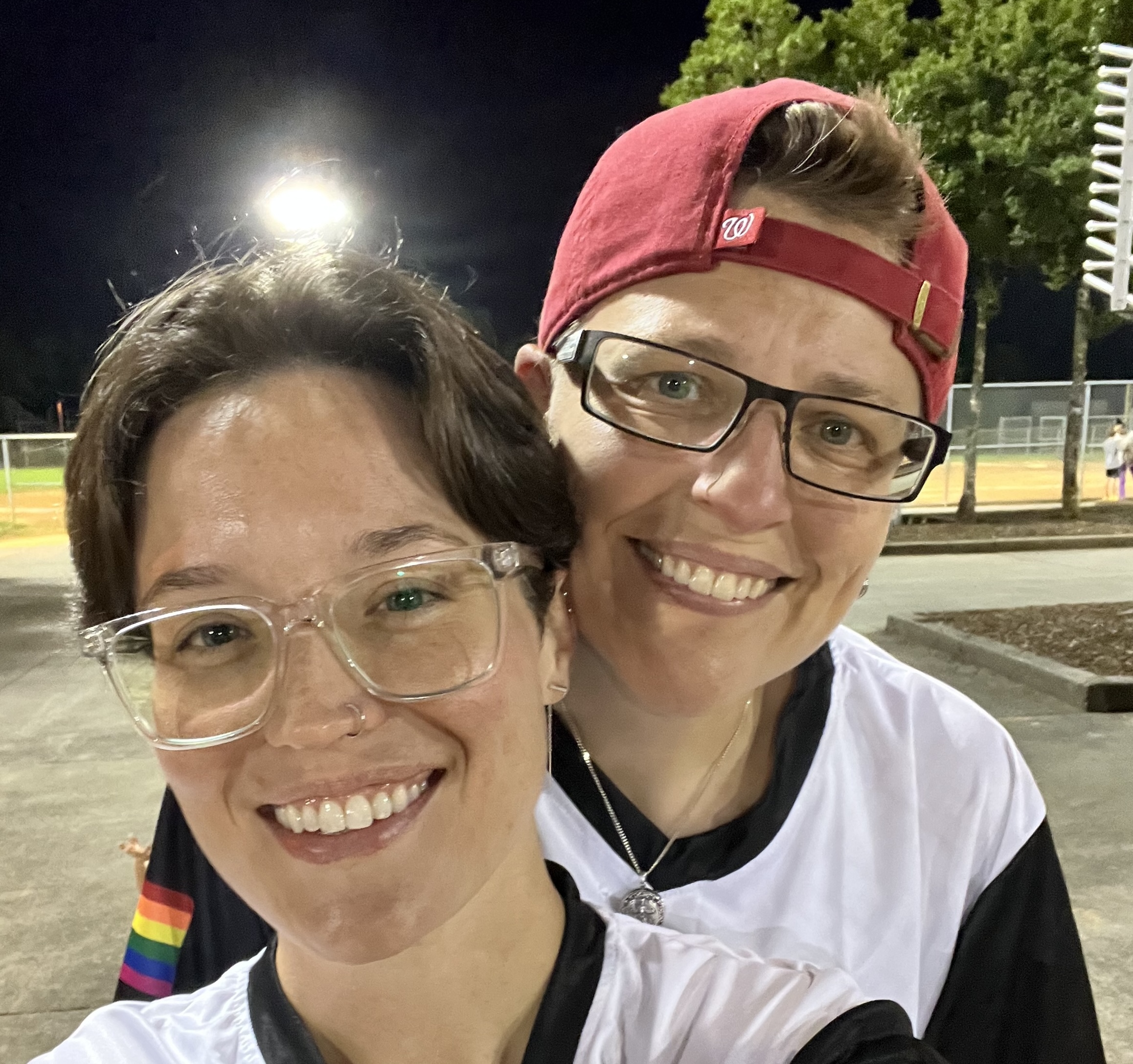 Kate with her wife playing softball.